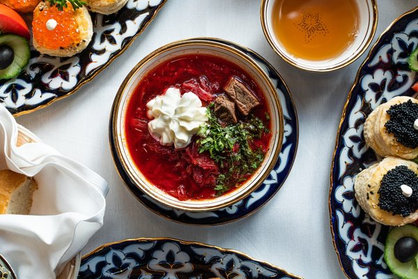 How Can You Create a Traditional Russian Borscht with a Sour Cream Garnish?